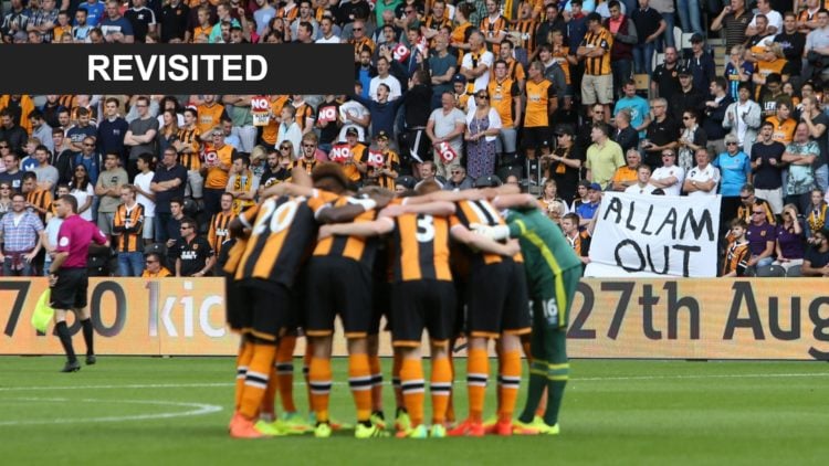 Hull City team talk in front of an Allam out poster ahead of the Premier League match between Leicester City and Hull City. Overlaid, Revisited banner