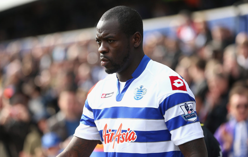 Chris Samba walks out onto the pitch for QPR vs Wigan Athletic