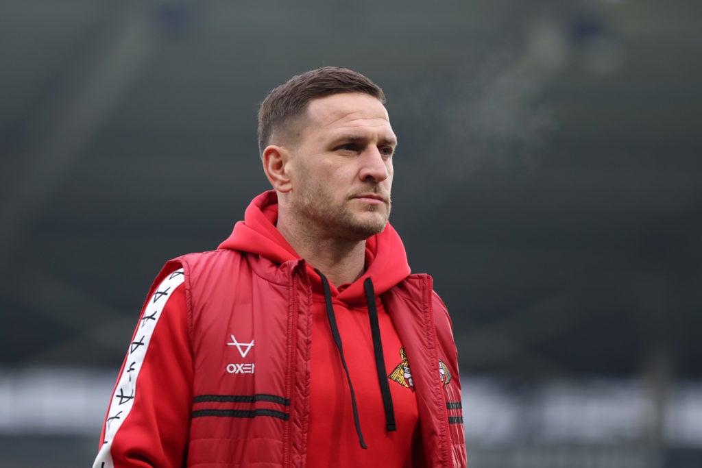 Billy Sharp of Doncaster Rovers inspects the pitch prior to the Emirates FA Cup Third Round match between Hull City and Doncaster Rovers