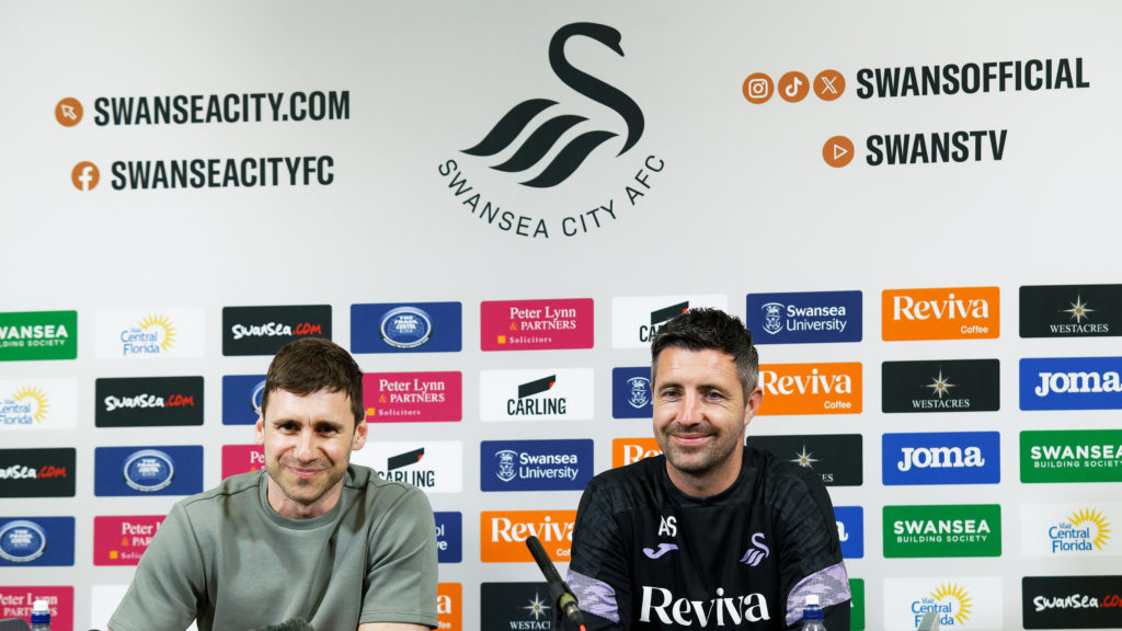 Richard Montague, Director of Football and manager Alan Sheehan answer questions during the Swansea City Press Conference