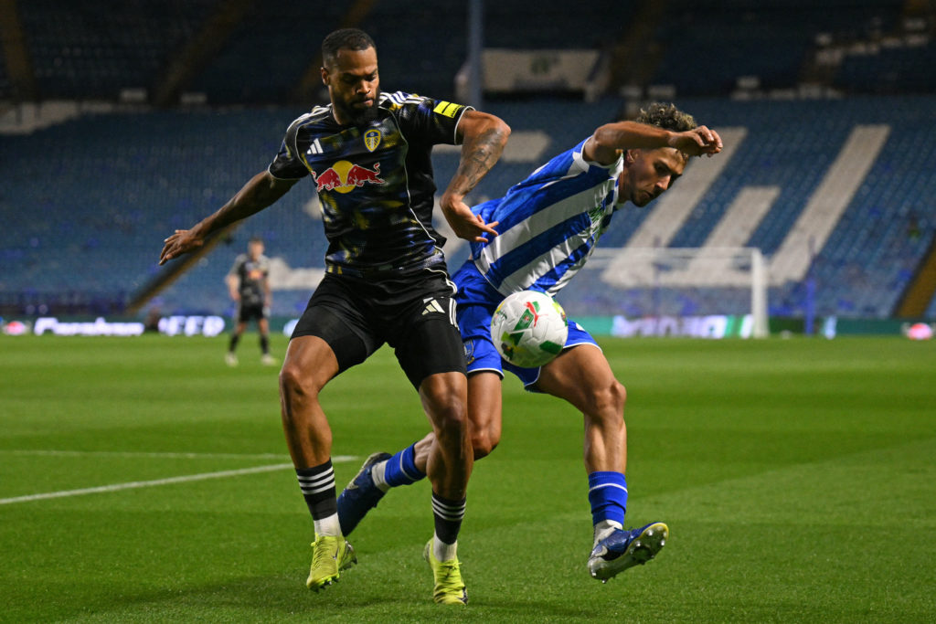 Gui Siqueira battles for the ball with Lukas Nmecha for Sheffield Wednesday against Leeds United