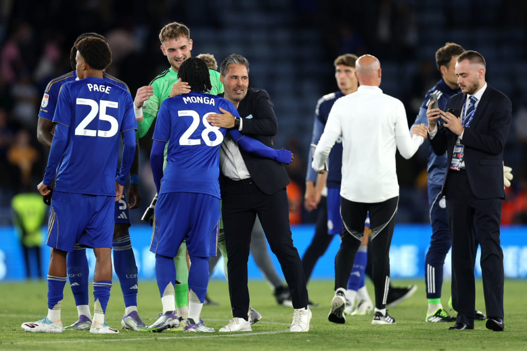 Marti Cifuentes embraces Jeremy Monga and Louis Page after Leicester City's win vs Birmingham City
