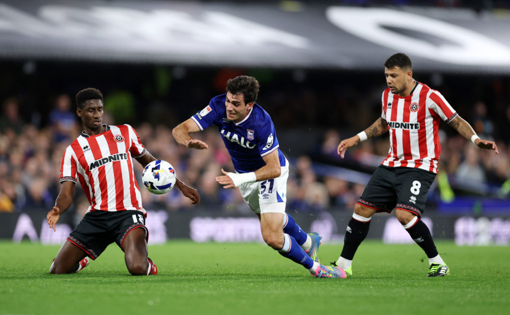 Ivan Azon Monzon of Ipswich Town is challenged by Djibril Soumare and Gustavo Hamer of Sheffield United