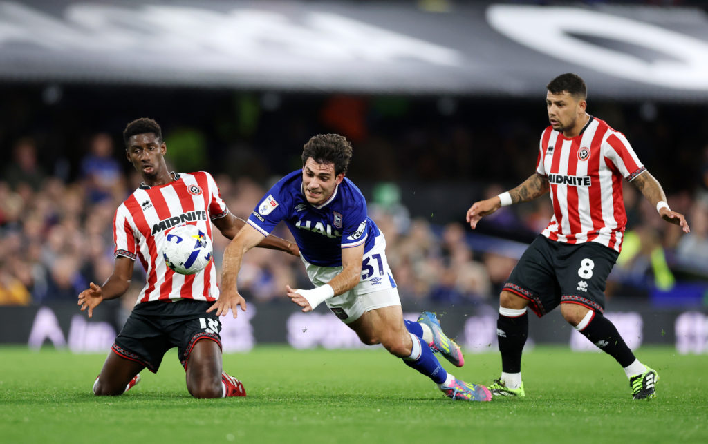Ivan Azon Monzon of Ipswich Town is challenged by Djibril Soumare and Gustavo Hamer of Sheffield United