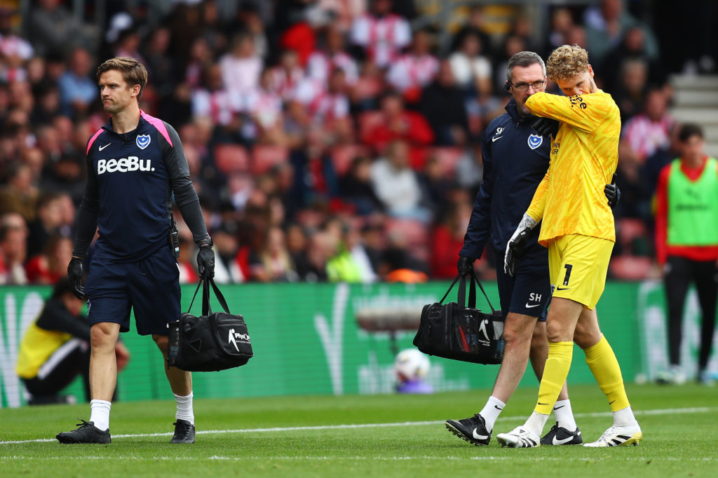 Nicolas Schmid leaving the pitch injured during Portsmouth v Southampton