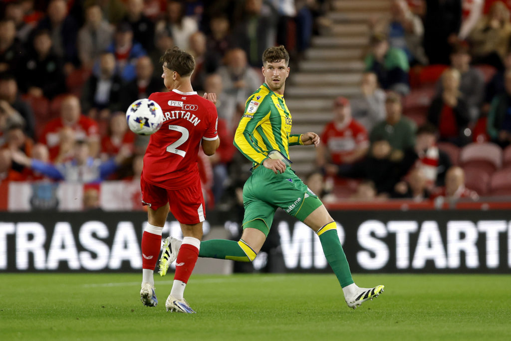 Chris Mepham of West Bromwich Albion chips the ball past Callum Brittain of Middlesbrough