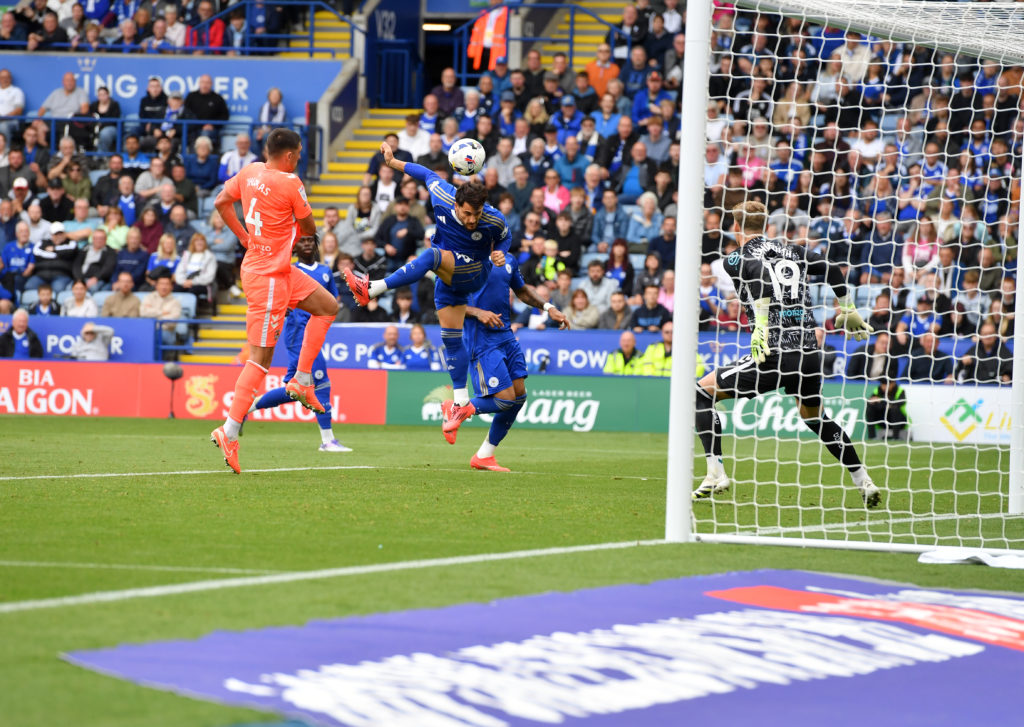 Julian Carranza of Leicester City heads towards Carl Rushworth