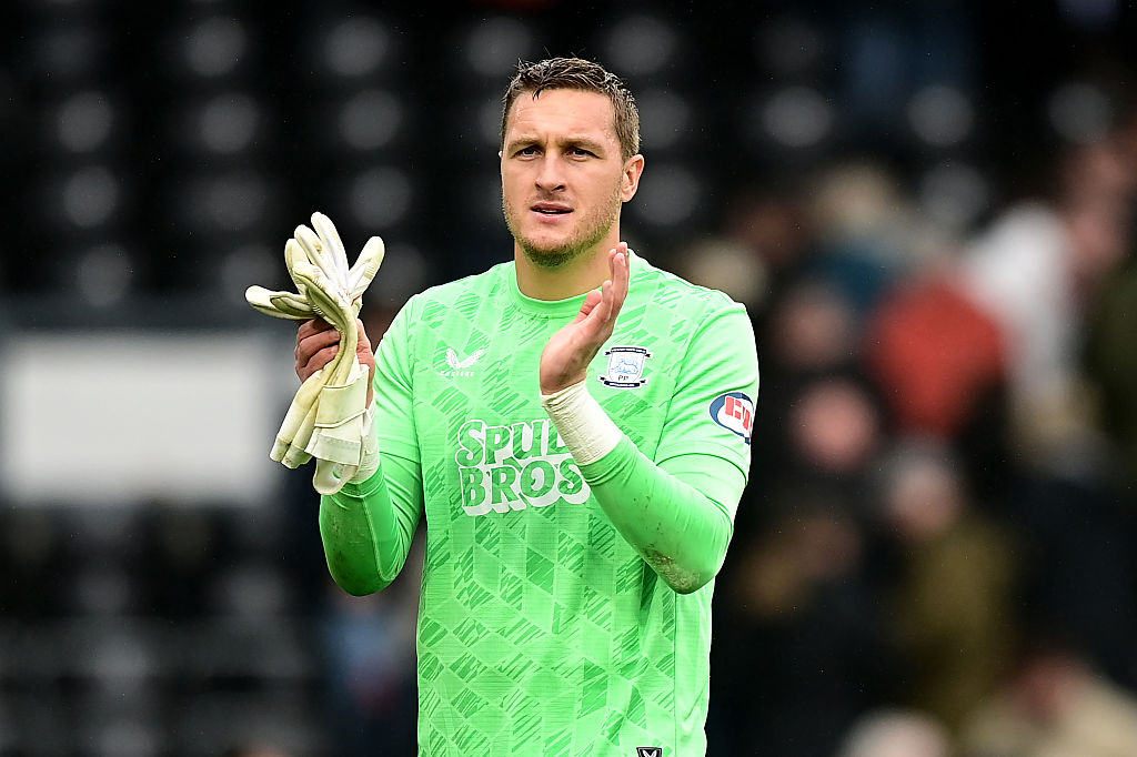 Preston North End goalkeeper Daniel Iversen applauds against Derby County.
