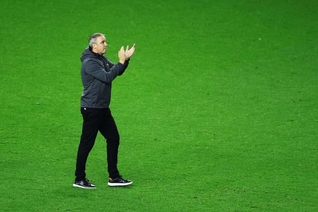 Wycombe Wanderers manager Michael Duff applauds the fans after beating Wigan Athletic