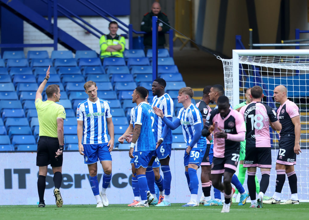 Referee John Brooks awards QPR a penalty against Sheffield Wednesday