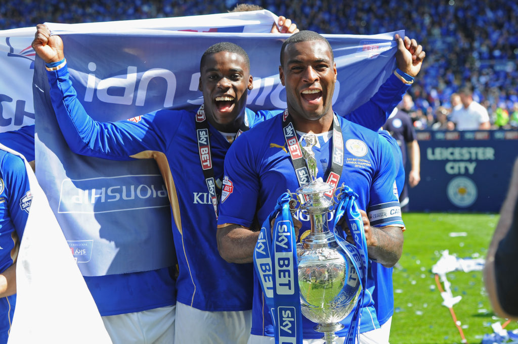 Wes Morgan and Jeffrey Schlupp pose after Leicester City are crowned champions of the Championship
