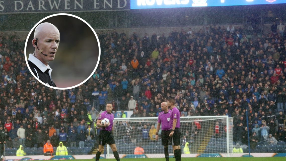 Referee Stephen Martin inspects the waterlogged pitch at Ewood Park before abandoning play due to heavy rain during the Sky Bet Championship match ...