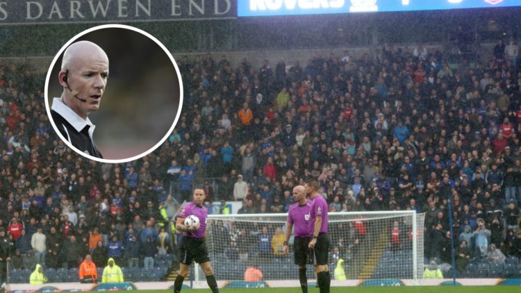 Referee Stephen Martin inspects the waterlogged pitch at Ewood Park before abandoning play due to heavy rain during the Sky Bet Championship match ...